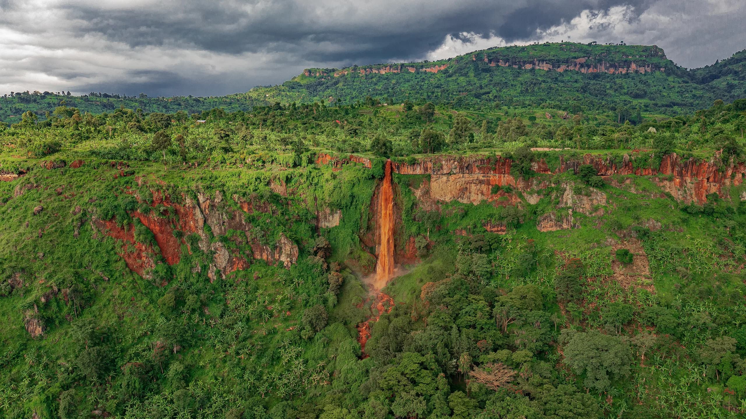 The Nyakasura falls beside the caves
