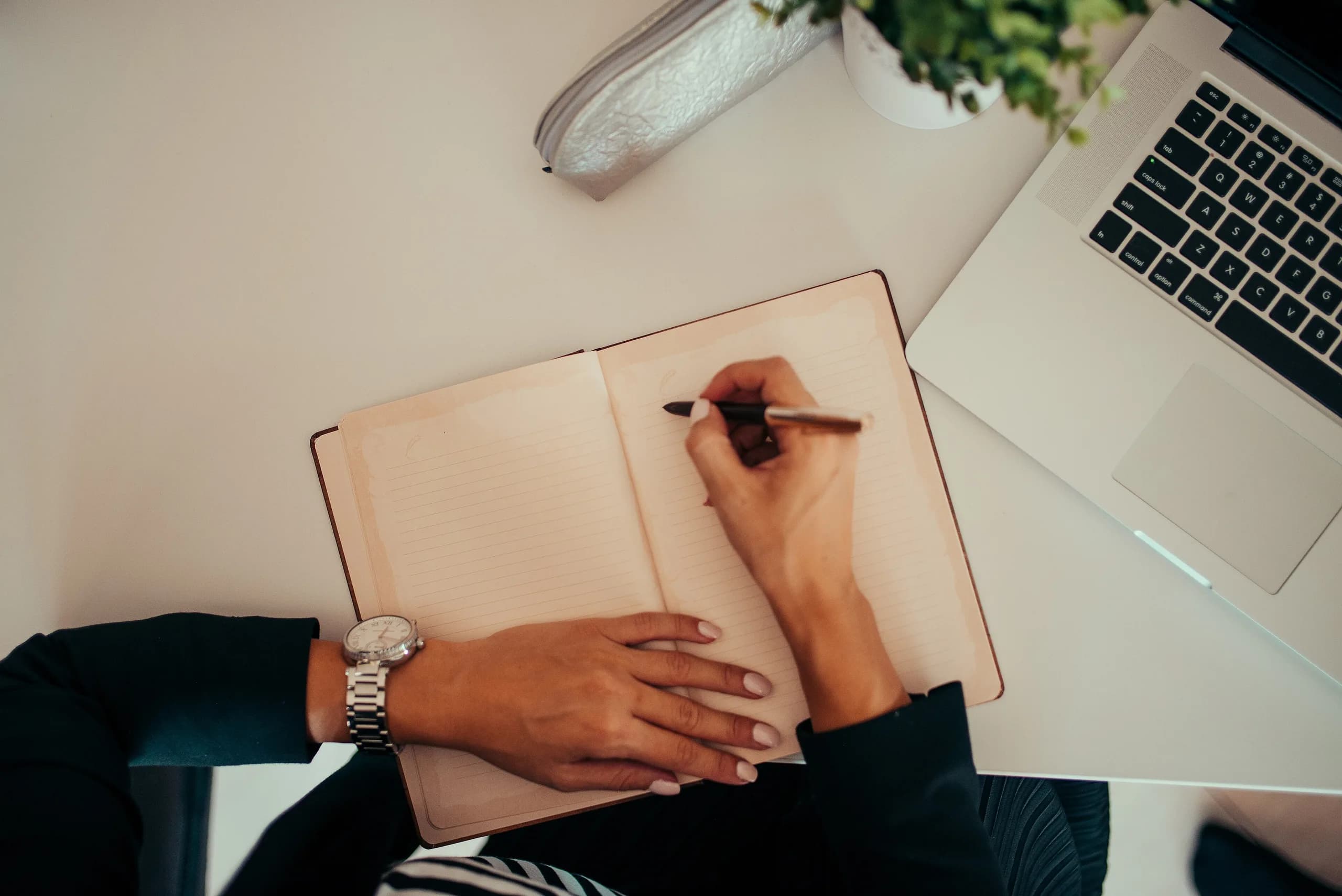 A day by day itinerary being written out at a desk